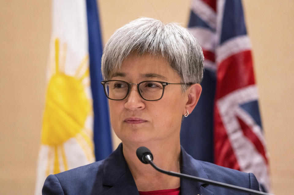 Australian Foreign Minister Penny Wong listens beside Philippine Foreign Affairs Secretary Enrique Manalo during a joint press conference at a hotel in Makati City, Philippines on Thursday May 18, 2023. (Lisa Marie David/Pool Photo via AP)