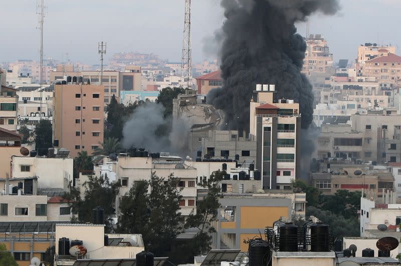 Smoke rises following an Israeli air strike on a building, amid a flare-up of Israeli-Palestinian fighting, in Gaza City