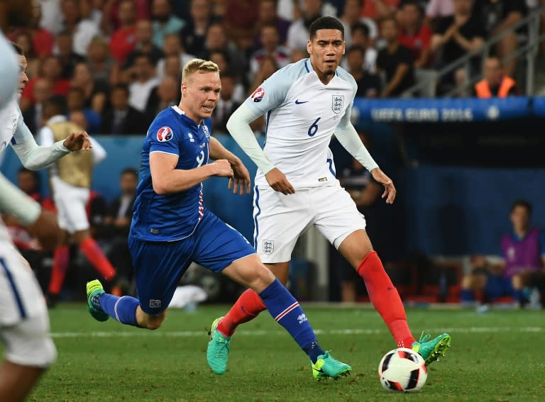 England's defender Chris Smalling (R) and Iceland's forward Kolbeinn Sigthorsson vie for the ball during Euro 2016 round of 16 football match between England and Iceland at the Allianz Riviera stadium in Nice on June 27, 2016