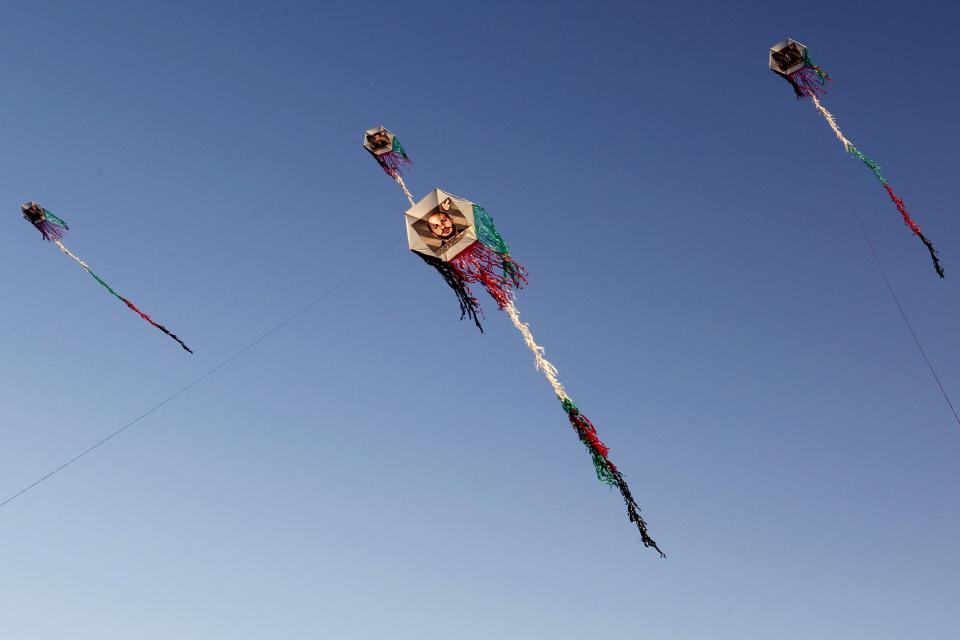 Kites with the portraits of Jordanian prisoners held in Israeli jails are flown by activists and family members in Amman