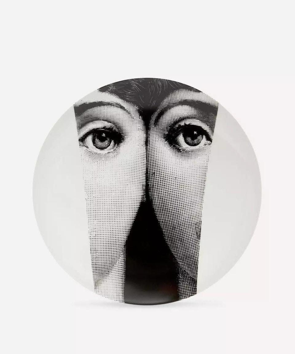 <p> There’s no mistaking Fornasetti’s distinctive aesthetic; this porcelain wall plate is number 13 in the series of endless variations on the face of the designer’s muse, Lina Cavalieri. Hand crafted in Milan, it would make a wonderfully surreal finishing touch to a hallway or reading nook. £135, <a href="https://www.libertylondon.com/uk/wall-plate-no.13-000629200.html#pos=6" rel="nofollow noopener" target="_blank" data-ylk="slk:libertylondon.com" class="link ">libertylondon.com</a></p>