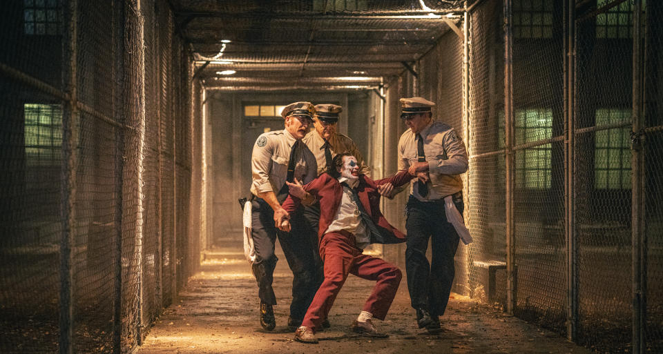 (L to r) BRENDAN GLEESON as Jackie Sullivan and JOAQUIN PHOENIX as Arthur Fleck in Warner Bros. Pictures’ “JOKER: FOLIE À DEUX,” a Warner Bros. Pictures release. (Scott Garfield/DC Comics)