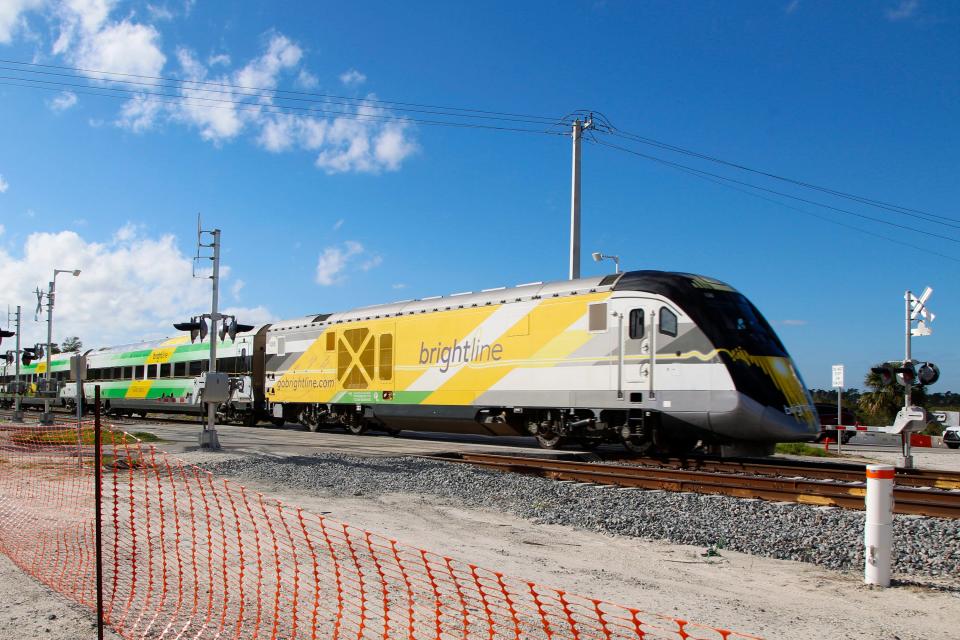 A Brightline train passes through St. Lucie County near Savannas Preserve State Park on Friday, Oct. 21, 2022. 