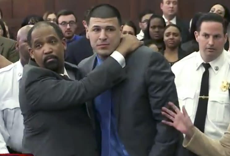 Aaron Hernandez is hugged by defense attorney Ronald Sullivan after being found not guilty of murder. (AP)