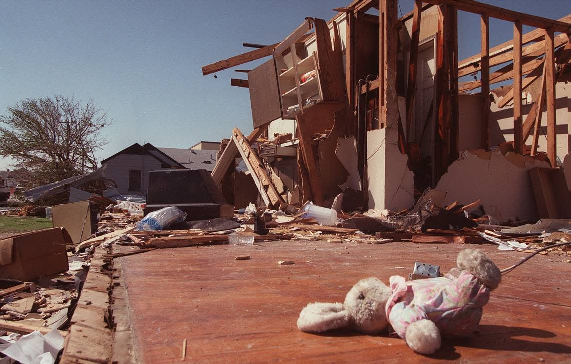 A stuffed animal amid debris strewn along Mercedes Street in Fort Worth after a tornado on March 28, 2000.