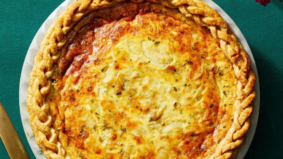 onion and gruyere quiche with a braided crust