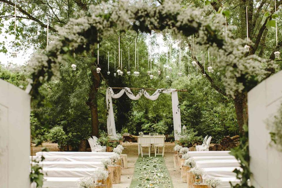 <p>Getty</p> Image of a rustic backyard wedding ceremony 