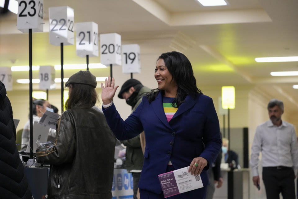 San Francisco Mayor London Breed, center, arrives at City Hall to drop off her ballot to vote in the state's primary election Tuesday, March 5, 2024, in San Francisco. (AP Photo/Godofredo A. Vásquez)