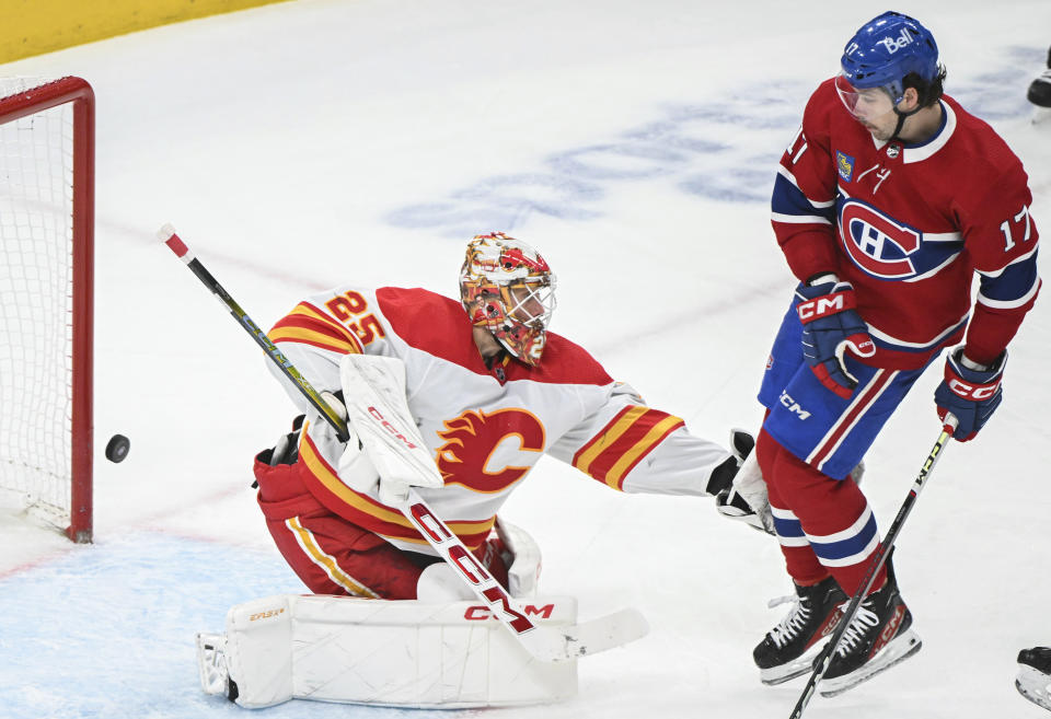 Montreal Canadiens' Josh Anderson (17) moves in on Calgary Flames goaltender Jacob Markstrom during the third period of an NHL hockey match in Montreal, Quebec, Tuesday, Nov. 14, 2023. (Graham Hughes/The Canadian Press via AP)