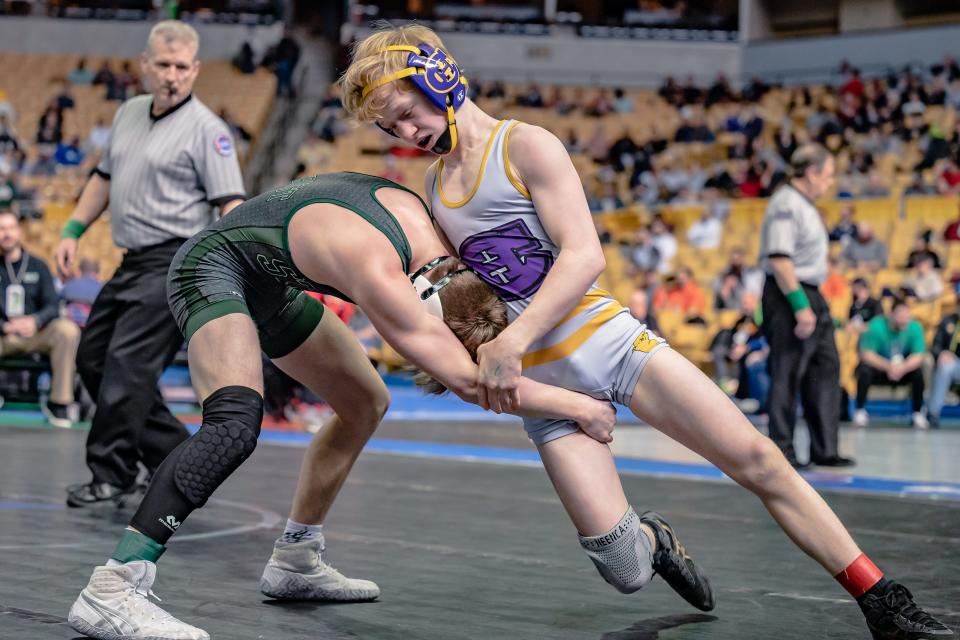 Hickman's Hank Benter (106) works to take down Staley's Parker Leverknight before getting the pin and winning his state quarterfinal match at Mizzou Arena.