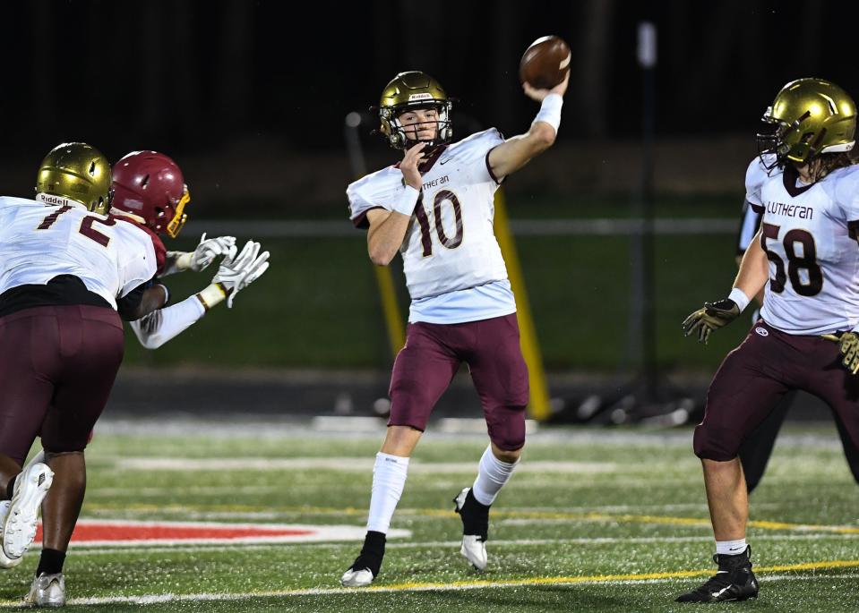 Lutheran's Jackson Willis (10) throws a pass against Scecina Memorial during the second half of the game on Friday, September 23, 2022, hosted at Roncalli High School Indianapolis. Lutheran defeated the Scecina Memorial 28-19.