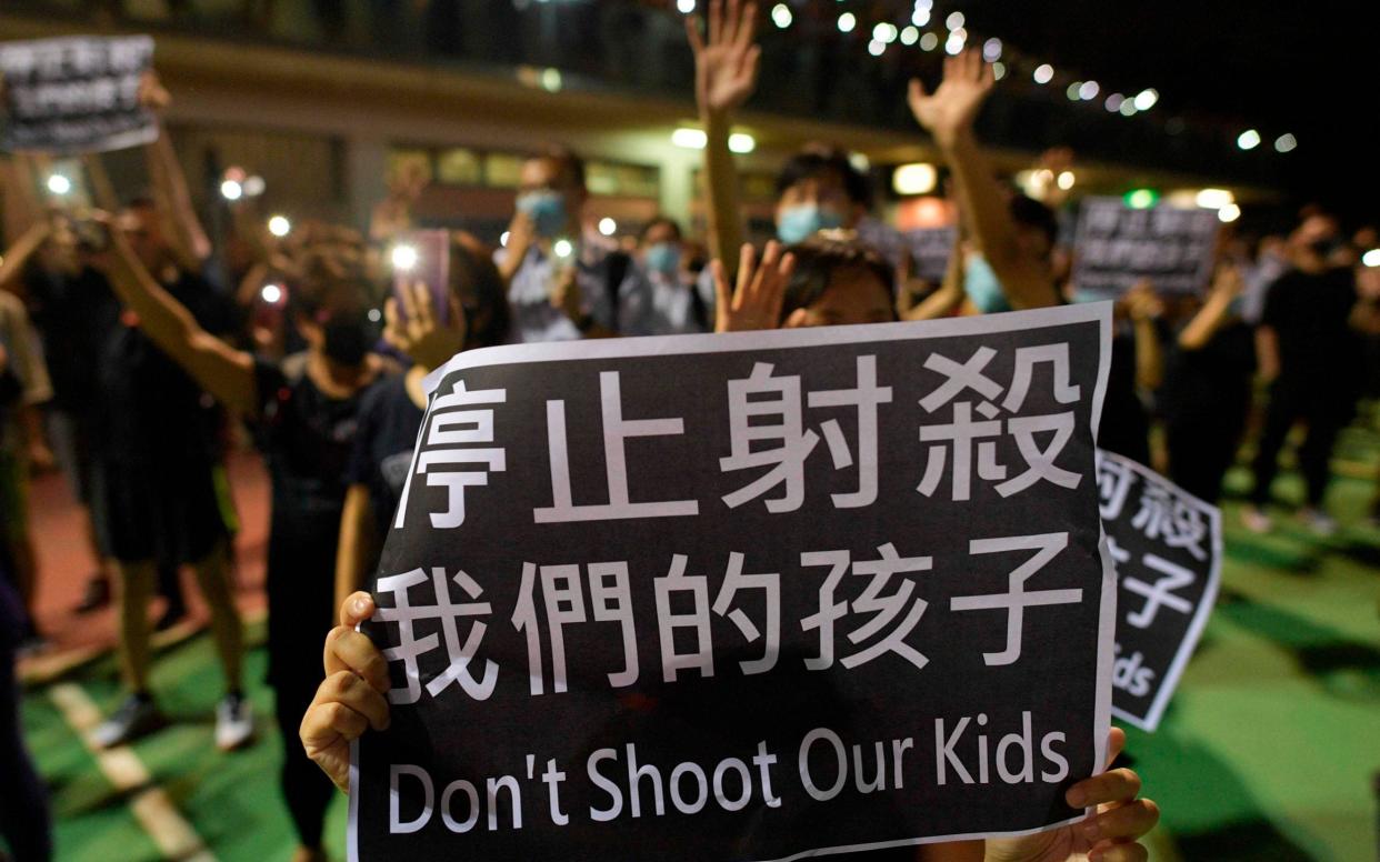 Protesters take to the streets after the police shooting of a Hong Kong teenager - AFP