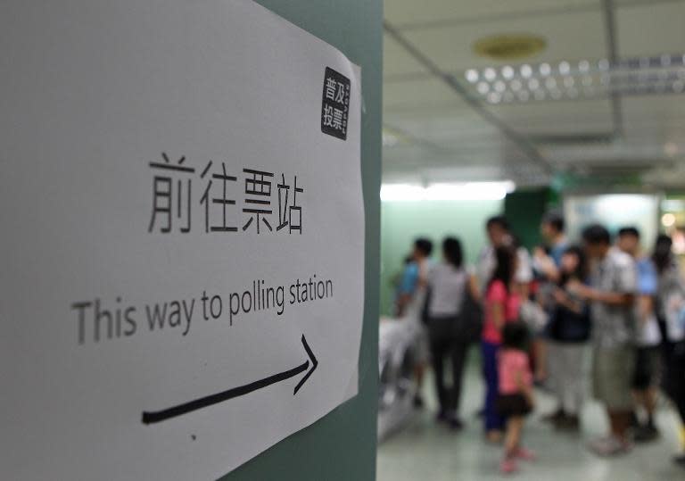 Voters enter a polling station in Hong Kong on June 29, 2014