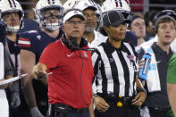 Arizona coach Jedd Fisch asks for a replay review after a play against Northern Arizona during the first half during an NCAA college football game Saturday, Sept. 2, 2023, in Tucson, Ariz. (AP Photo/Rick Scuteri)