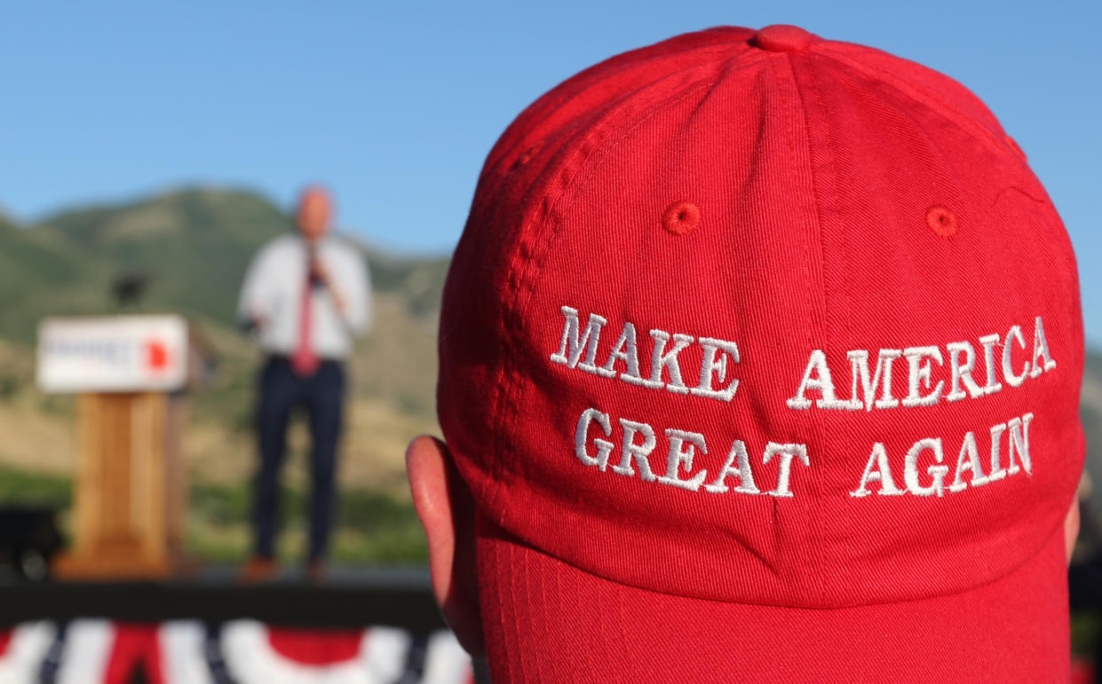 A Romney supporter listens to a speaker as he wears a “Make America Great Again” hat at a Mitt Romney election party in Orem, Utah, June 26, 2018. (Photo: George Frey/Getty Images)