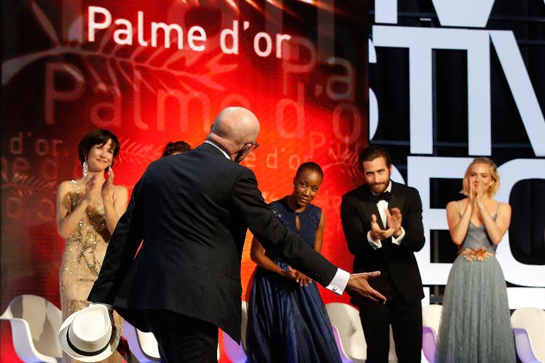 French director Jacques Audiard thanks jury members after being awarded with the Palme d'Or during the closing ceremony of the 68th Cannes Film Festival in Cannes, France, on May 24, 2015