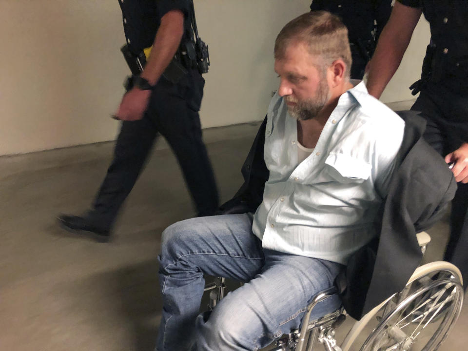 FILE - Anti-government activist Ammon Bundy is wheeled from the Idaho Statehouse in Boise, Idaho, Wednesday, Aug. 26, 2020, following his second arrest for trespassing. St. Luke’s Regional Health sued Bundy for defamation more than a year ago. Since then, Bundy has ignored subpoenas and called on scores of his followers to camp at his home when he learned he could be arrested for contempt of court. (AP Photo/Keith Ridler, File)