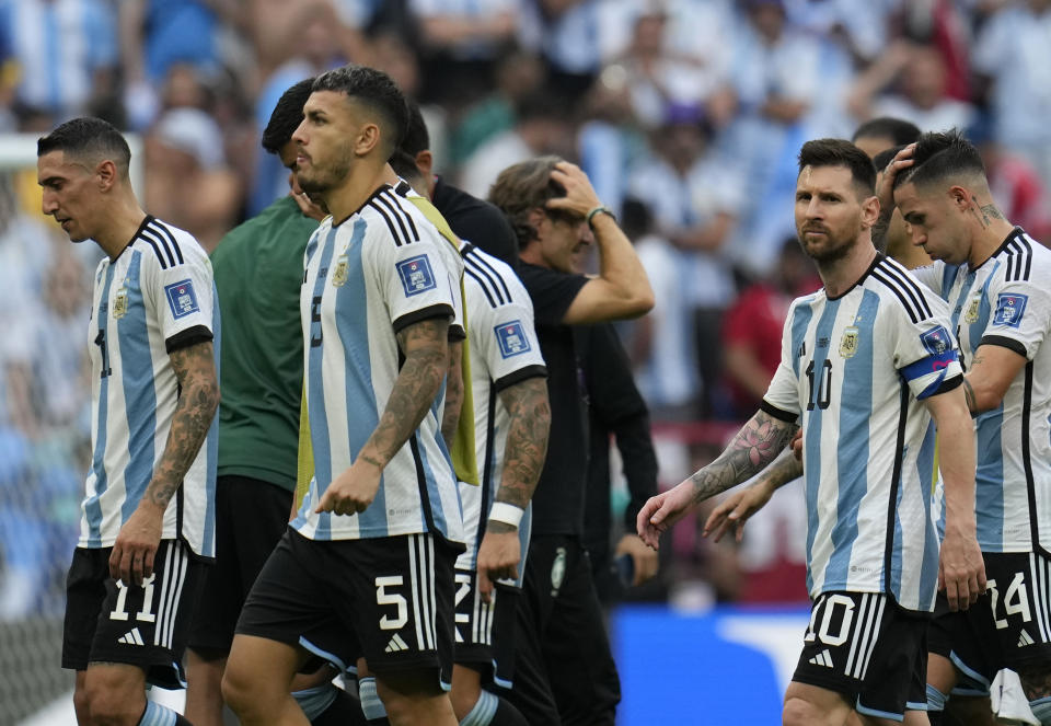 Argentina players leave the field at the end of the World Cup group C soccer match between Argentina and Saudi Arabia at the Lusail Stadium in Lusail, Qatar, Tuesday, Nov. 22, 2022. (AP Photo/Ricardo Mazalan)