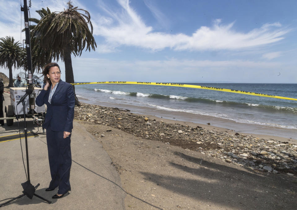 FILE - In this June 4, 2015, file photo California Attorney General looks back at closed off areas affected by an oil spill at Refugio State Beach, north of Goleta, Calif. (AP Photo/Damian Dovarganes, File)