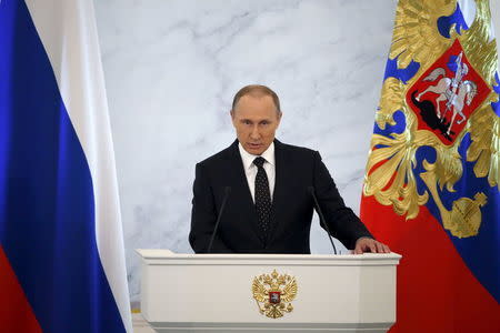 Russian President Vladimir Putin addresses the Federal Assembly, including State Duma deputies, members of the Federation Council, regional governors and civil society representatives, at the Kremlin in Moscow, Russia, December 3, 2015. REUTERS/Sergei Karpukhin