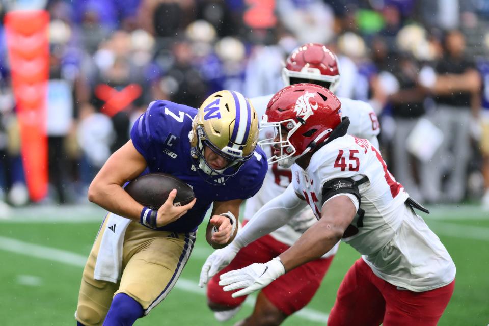 Washington State Cougars edge Raam Stevenson (45) sacks Washington Huskies quarterback Will Rogers (7) during the second half at Lumen Field on Saturday in Seattle.