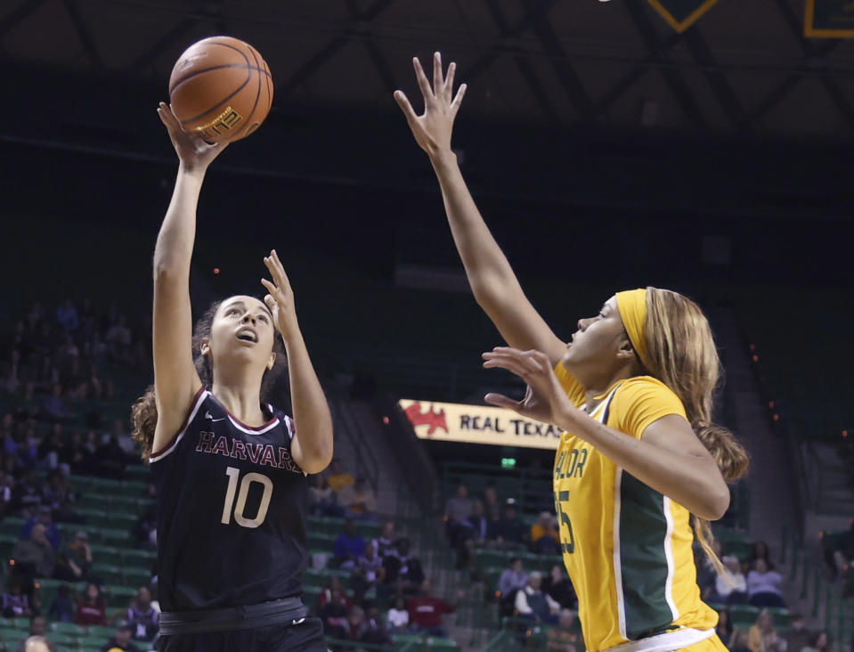 Harvard guard Elena Rodriguez, left, attempts a shot over Baylor center Lety Vasconcelos, right, in the first half of an NCAA college basketball game, Sunday, Nov. 19, 2023, in Waco, Texas. (Rod Aydelotte/Waco Tribune-Herald via AP)