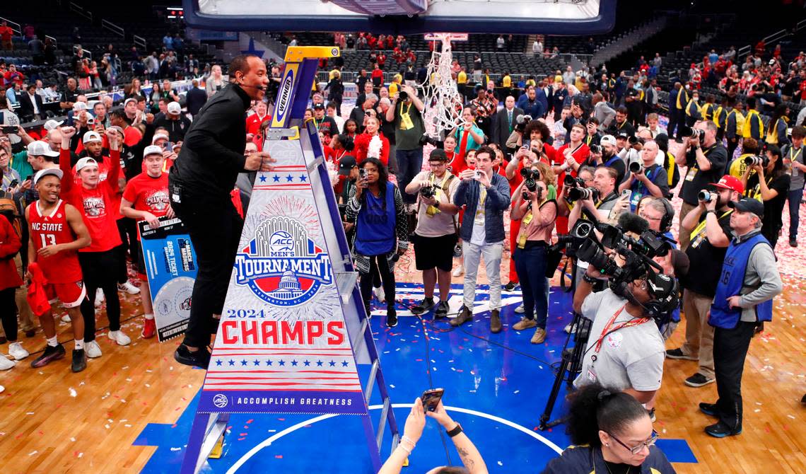N.C. State head coach Kevin Keatts heads up the ladder to cut down the net after N.C. State’s 84-76 victory over UNC in the championship game of the 2024 ACC Men’s Basketball Tournament at Capital One Arena in Washington, D.C., Saturday, March 16, 2024.