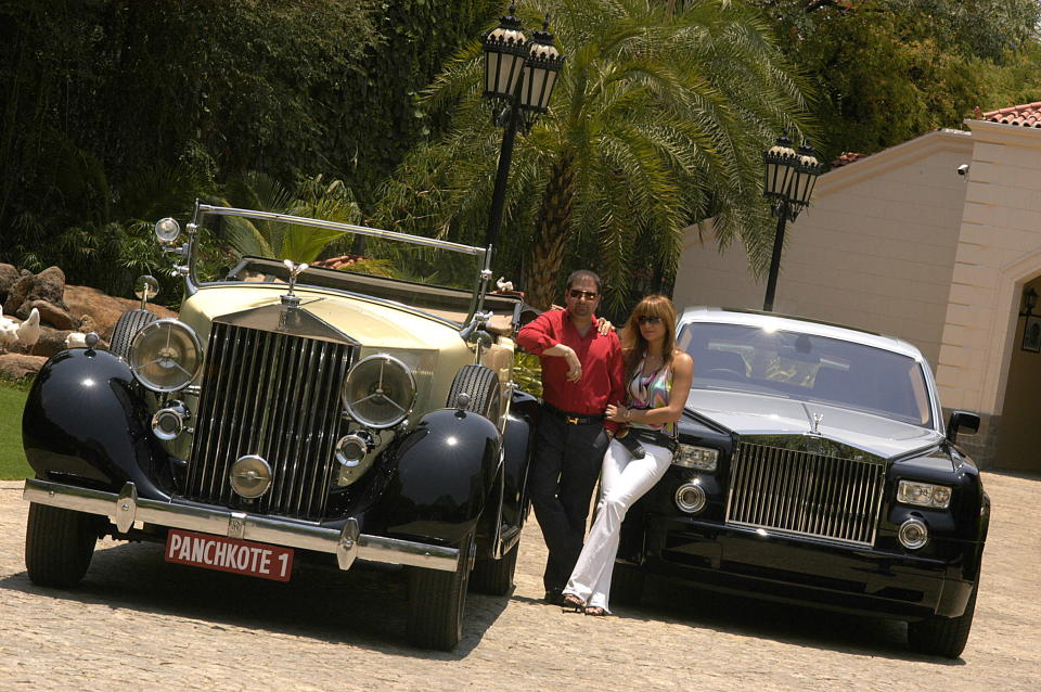 INDIA - MAY 10:  Yohan Poonawalla with his wife and two of his Rolls Royce cars. The favourite car of the maharajahs is making a comeback in India after half-a-century.  (Photo by Fawzan Husain/The The India Today Group via Getty Images)