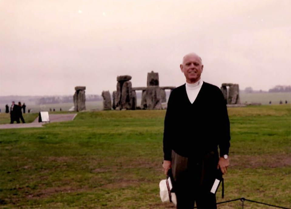 Fred Seely in a photograph in front of Stonehenge in the United Kingdom.