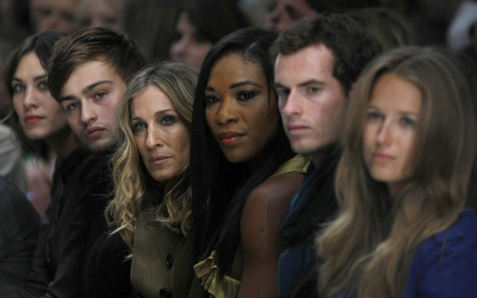 FILE - U.S. tennis player Serena Williams, center right, Britain's tennis player Andy Murray, second from right, Kim Sears, right, and U.S. actress Sarah Jessica Parker, center left, watches the Burberry Prorsum show with Britain's Alexa Chung, left, during London Fashion Week, Tuesday, Sept. 21, 2010, in London. After nearly three decades in the public eye, few can match Serena Williams' array of accomplishments, medals and awards. Through it all, the 23-time Grand Slam title winner hasn't let the public forget that she's a Black American woman who embraces her responsibility as a beacon for her people. (AP Photo/Alastair Grant, File)