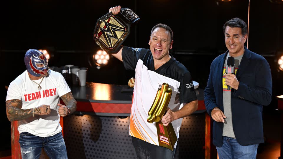 Joey Chestnut breaks his own world record by eating 83 hot dogs and buns in Netflix contest on Monday. - David Becker/Getty Images