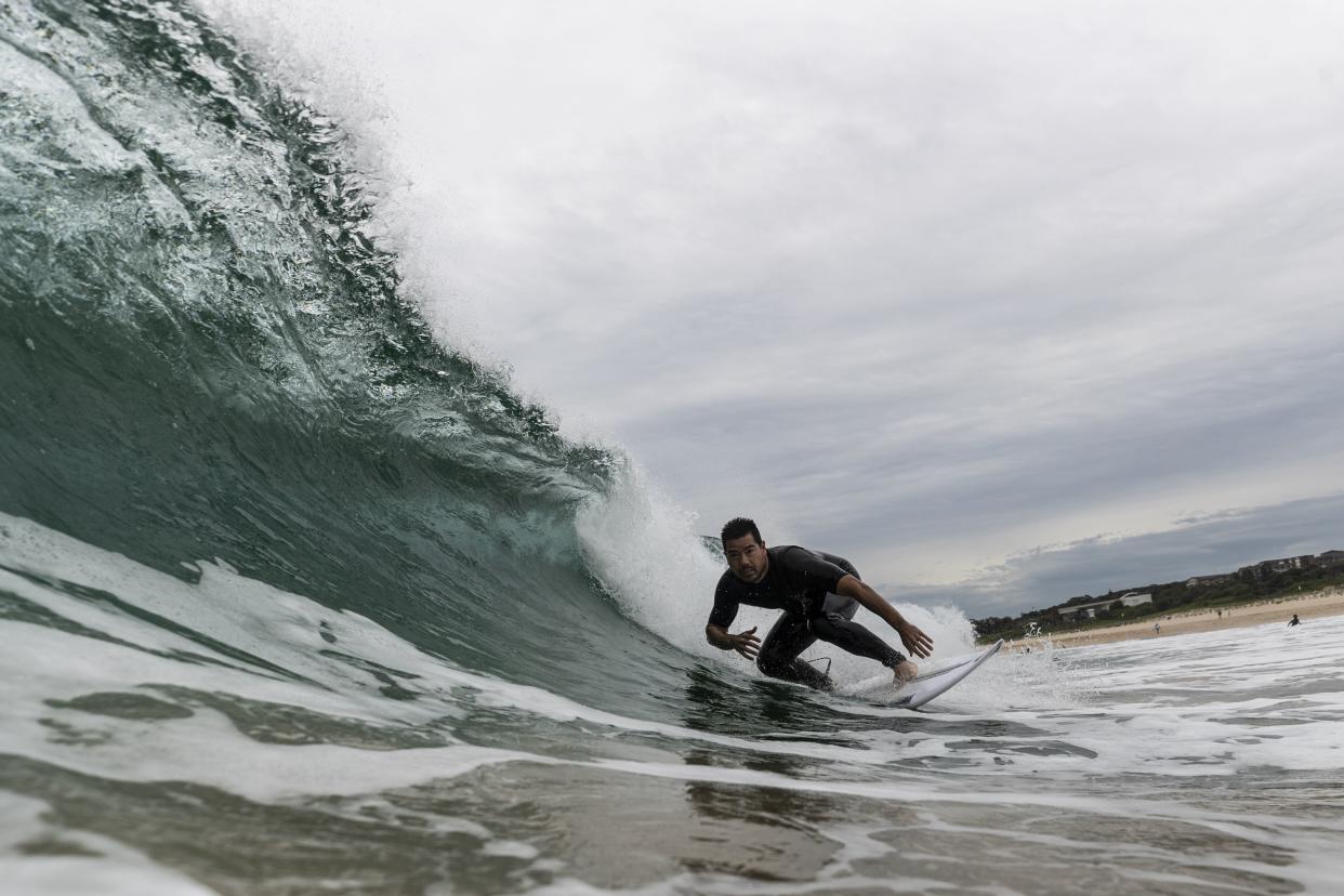 A surfer rides a wave at Maroubra beach on April 20, 2020, in Sydney, Australia. Coogee, Maroubra and Clovelly beaches in Randwick council reopened today for exercise only. Several beaches in Sydney's Eastern suburbs were closed March 28, after large crowds were seen gathering at Bondi Beach despite social distancing orders in place to slow the spread of COVID-19.