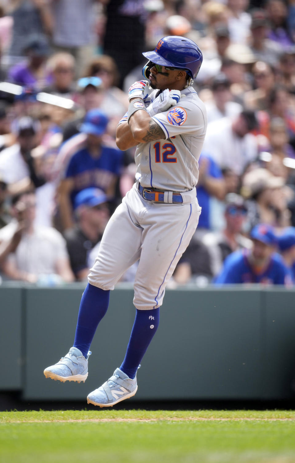 New York Mets' Francisco Lindor jumps as he circles the bases after hitting a solo home run off Colorado Rockies relief pitcher Peter Lambert in the seventh inning of a baseball game Sunday, May 28, 2023, in Denver. (AP Photo/David Zalubowski)