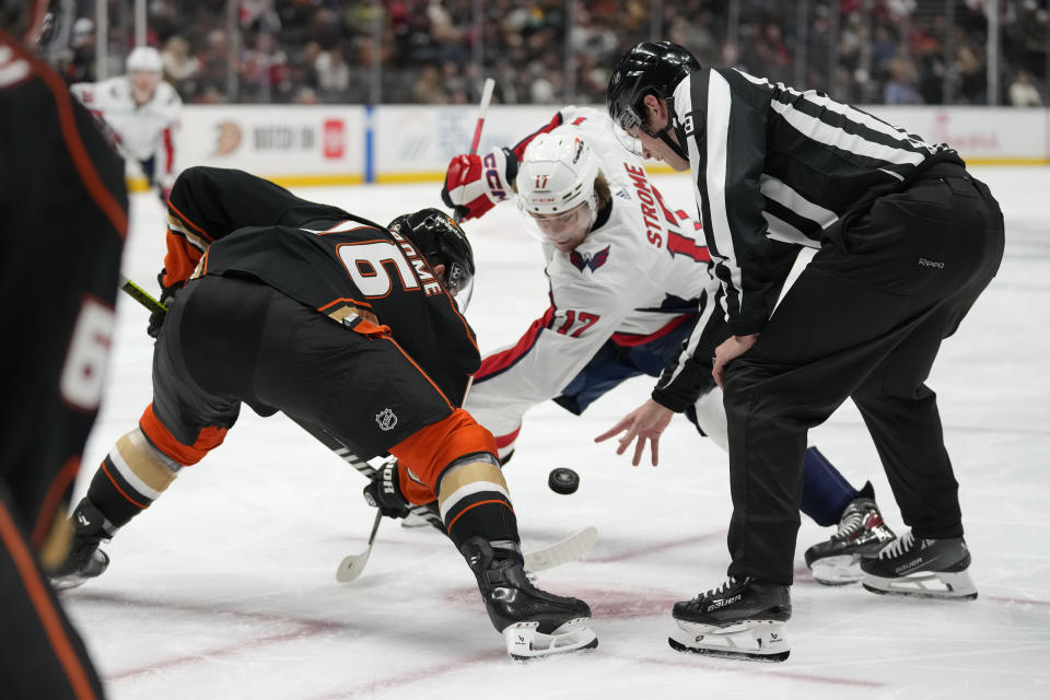 Anaheim Ducks center Ryan Strome (16) and Washington Capitals center Dylan Strome (17) faceoff during the second period of an NHL hockey game in Anaheim, Calif., Thursday, Nov. 30, 2023. (AP Photo/Ashley Landis)