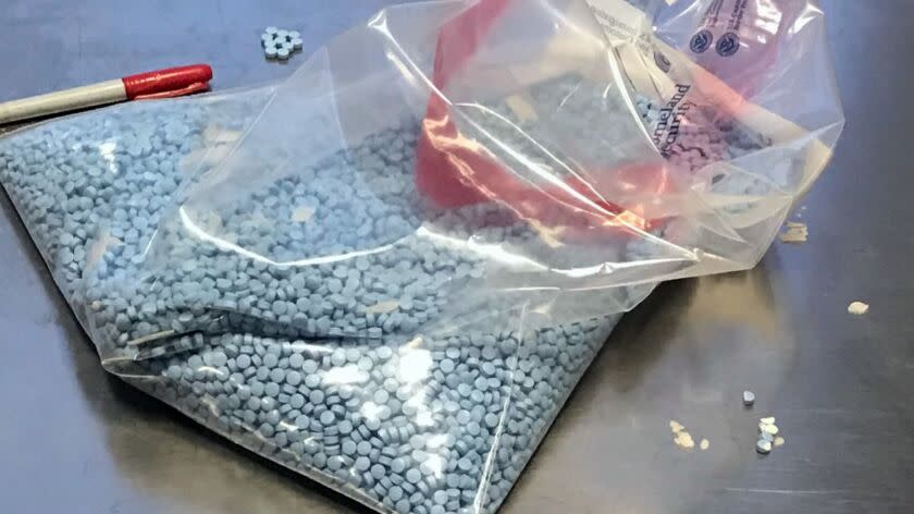 A bag of fentanyl-laced counterfeit pills is seized by law enforcement.