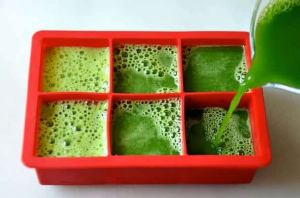 PHOTO: Blended green juice ingredients poured into large ice cube trays for popsicles. (Just a Taste)