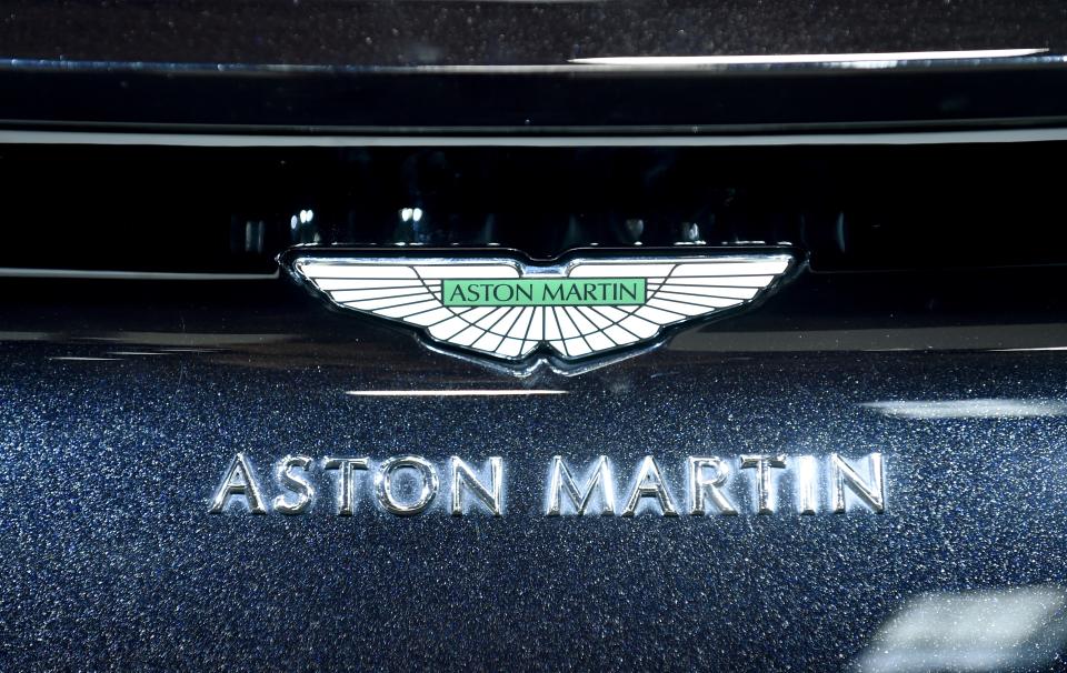 The logo of Aston Martin is seen on a car displayed at the Aston Martin stand during the press days of the Paris Motor Show on October 3, 2018. - Aston Martin on October 3, 2018 launched on the London stock market, valuing the British luxury sports car brand at £4.3 billion ($5.6 billion, 4.9 billion euros). (Photo by ERIC PIERMONT / AFP) (Photo by ERIC PIERMONT/AFP via Getty Images)