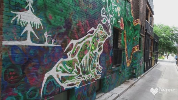 Part of the Story-telling Mural unveiled in Toronto on Saturday is shown here. It's located in Central Hospital Lane, between Carlton Street and Gerrard Street East, one block east of Sherbourne Street. (The Laneway Project - image credit)