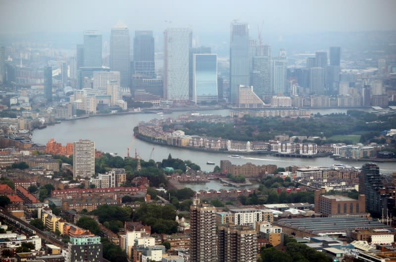 FILE PHOTO: The Canary Wharf financial district is seen from the construction site of 22 Bishopsgate in London