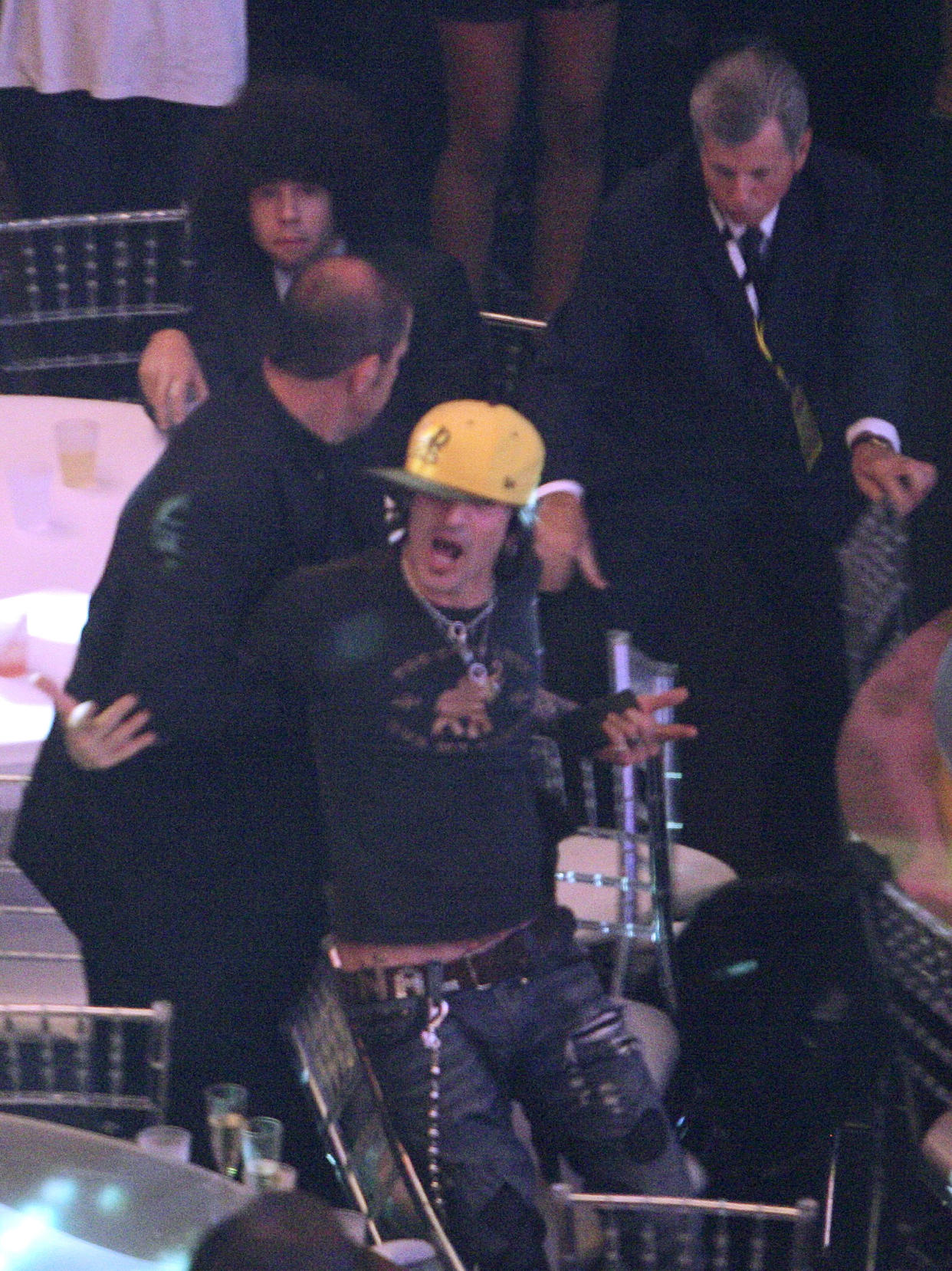 Tommy Lee is escorted out of the theater at the 2007 MTV Video Music Awards in Las Vegas September 9, 2007. Lee and Kid Rock, both former husbands of model Pamela Anderson, got into a fight while Alicia Keys was performing. 