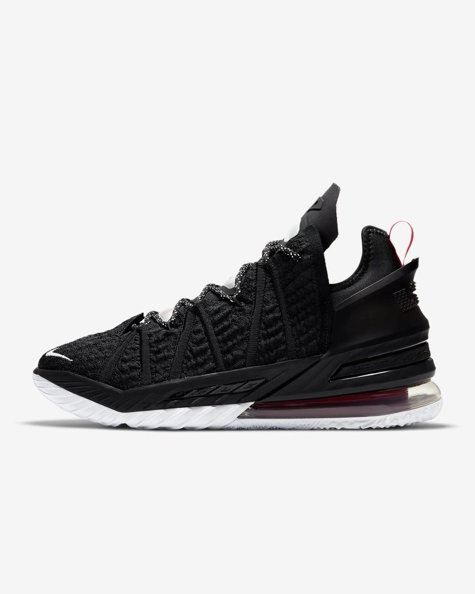 Black, red, and white Nike Lebron basketball shoe 