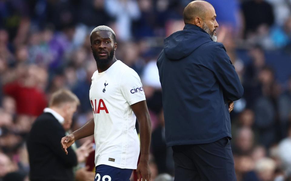 Tottenham Hotspur's Tanguy Ndombele walks off the pitch after being substituted as manager Nuno Espirito Santo - Reuters