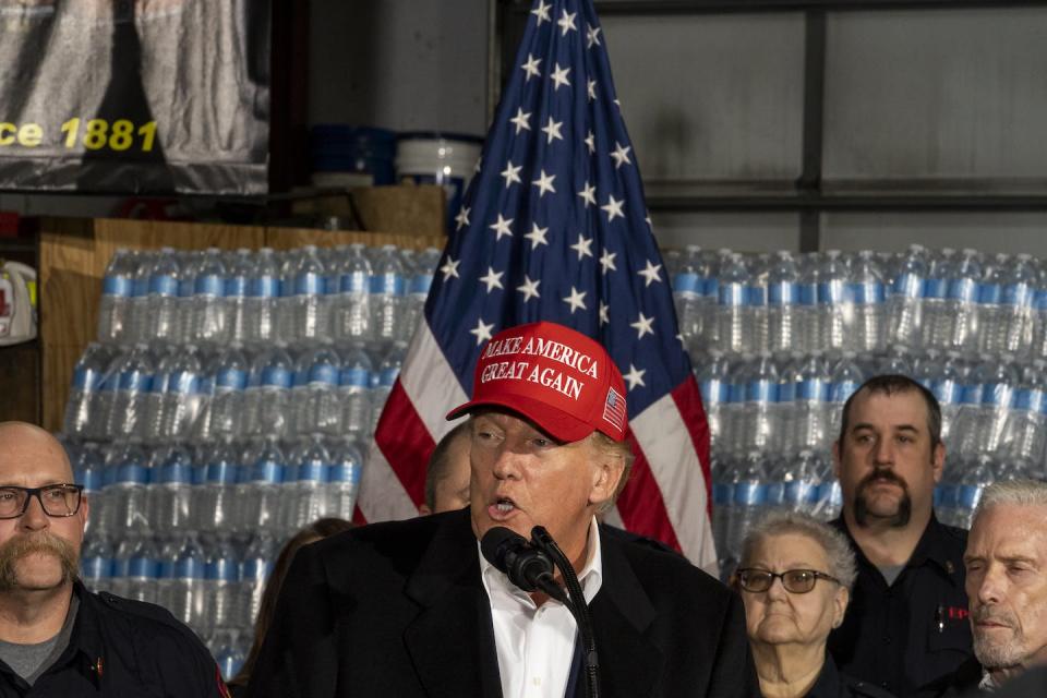 Former President Donald Trump delivers remarks on Feb. 22, 2023, to a crowd in East Palestine, Ohio, site of the Norfolk Southern train derailment earlier that month. <a href="https://www.gettyimages.com/detail/news-photo/former-president-donald-trump-stands-next-to-a-pallet-of-news-photo/1247391738?adppopup=true" rel="nofollow noopener" target="_blank" data-ylk="slk:Michael Swensen via Getty Images News;elm:context_link;itc:0;sec:content-canvas" class="link ">Michael Swensen via Getty Images News</a>