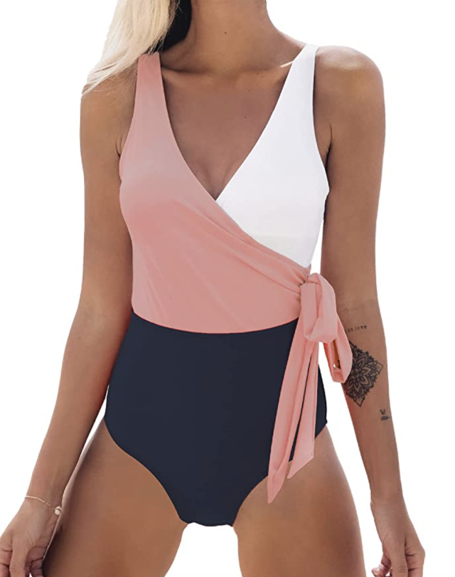 blonde model in pink, white, and navy bathing suit, CUPSHE V-Neck One-Piece in Pink/White (Photo via Amazon)