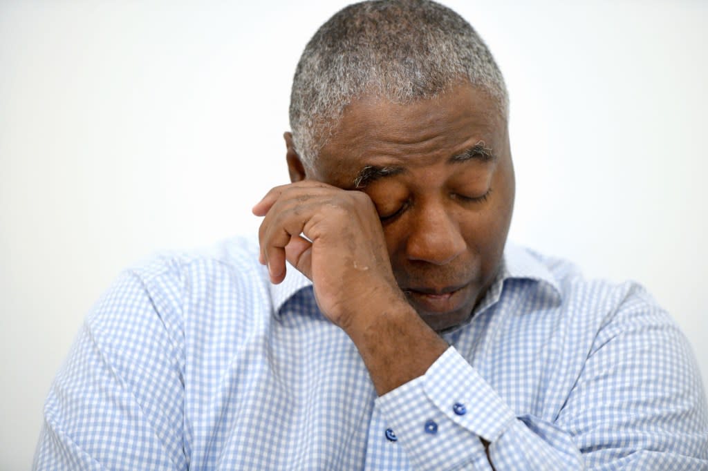Charles Richardson, of Baltimore, wipes his eye while discussing his alleged abuse decades ago by a Catholic priest, in Baltimore on Wednesday, Sept. 20, 2023. (AP Photo/Steve Ruark)