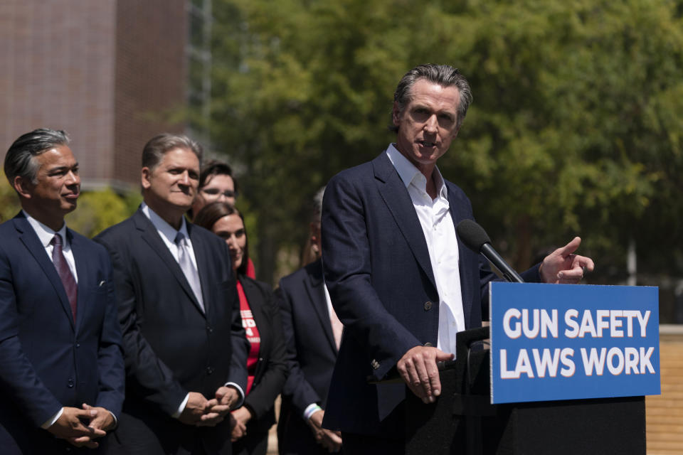 California Gov. Gavin Newsom speaks during a news conference as he is joined by California Attorney General Rob Bonta, left, and state Sen. Bob Hertzberg in Santa Monica, Calif., Friday, July 22, 2022. Gov. Newsom signed a gun control law Friday, a month after conservative justices overturned women's constitutional right to abortions and undermined gun control laws in states including California. (AP Photo/Jae C. Hong)