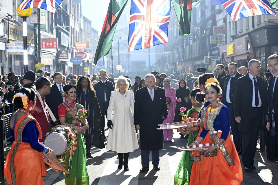 FILE - Britain's King Charles III and Camilla, the Queen Consort visit Brick Lane in east London, Wednesday Feb. 8, 2023, to meet with charities and businesses. King Charles III will be crowned Saturday, May 6, 2023 at Westminster Abbey in an event full of all the pageantry Britain can muster. (Eddie Mulholland/Pool via AP, File)