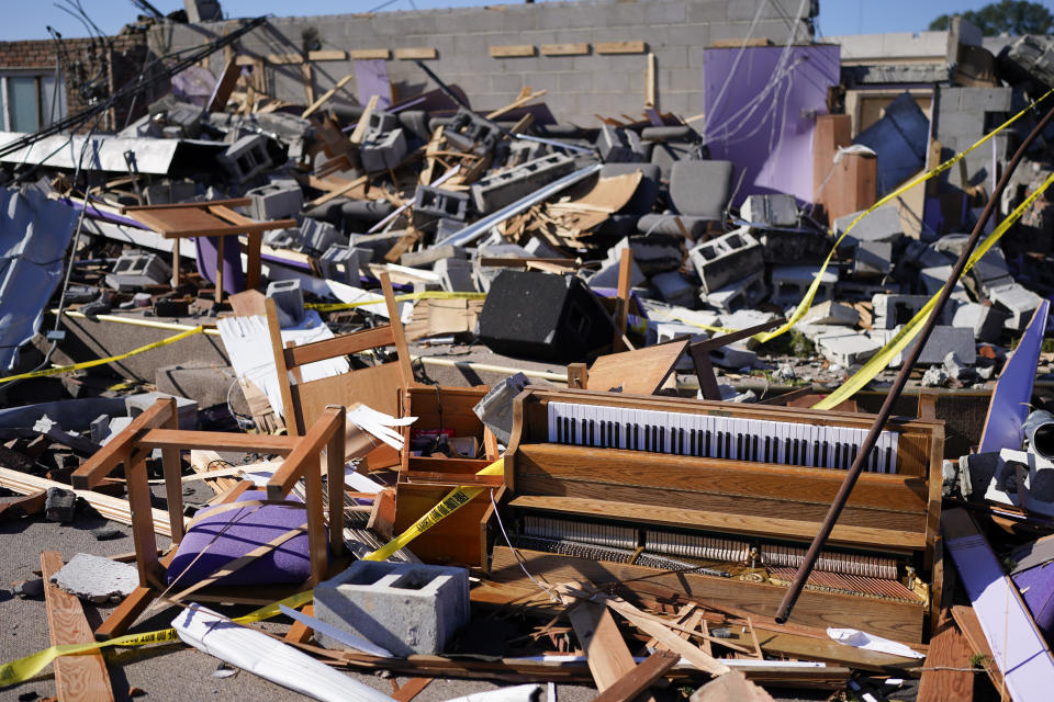 A piano and debris are seen in the sanctuary of Community Baptist Church, Monday, Dec. 11, 2023, in Nashville, Tenn. The church was destroyed when severe storms came through over the weekend. Members of the church were trapped and injured inside the building during the storm on Saturday. (AP Photo/George Walker IV)