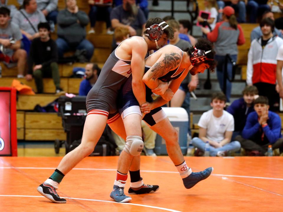 Utica's Clayton Smith, left, wrestles Licking Valley's Devyn Boyd during the finals at 144 pounds during the Licking Valley Invitational on Saturday, Jan. 7, 2023, in Hanover, Ohio.