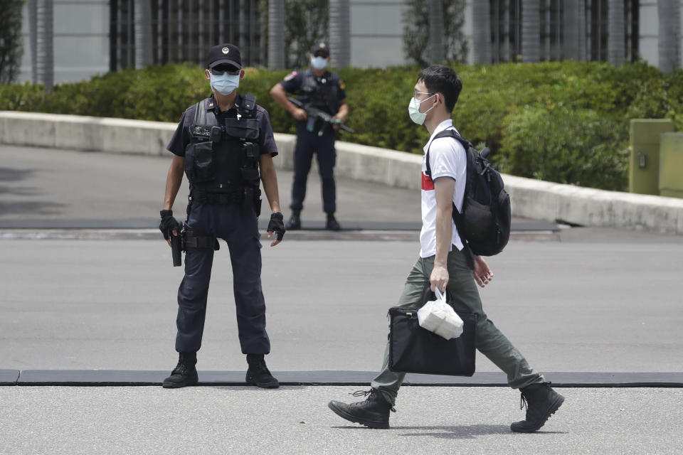 Soldiers guard outside the President Office as visiting U.S. House Speaker Nancy Pelosi meeting with Taiwan President Tsai Ing-wen in Taipei, Taiwan, Wednesday, Aug 3, 2022. Pelosi arrived in Taiwan late Tuesday, becoming the highest-ranking American official in 25 years to visit the self-ruled island claimed by China, which quickly announced that it would conduct military maneuvers in retaliation for her presence. (AP Photo/Chiang Ying-ying)